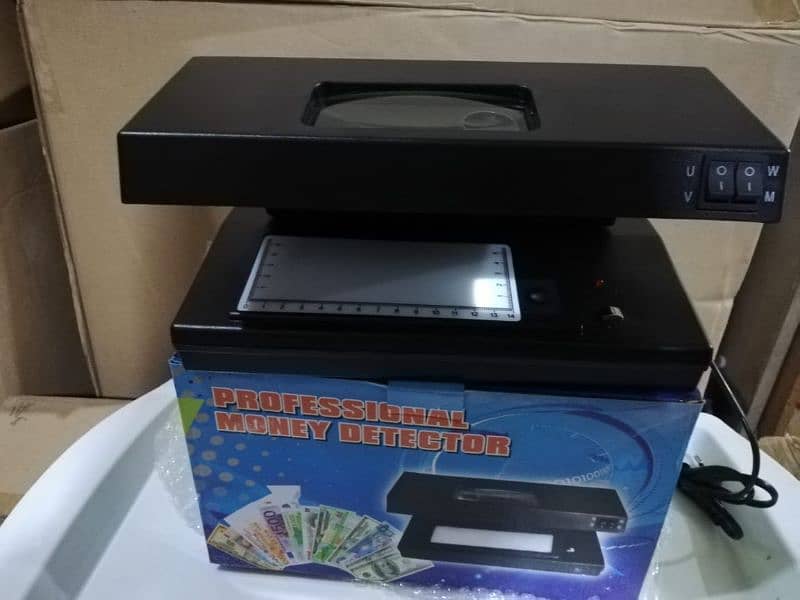 Cash counting machine mix note counting with fake detection Pakistan 3