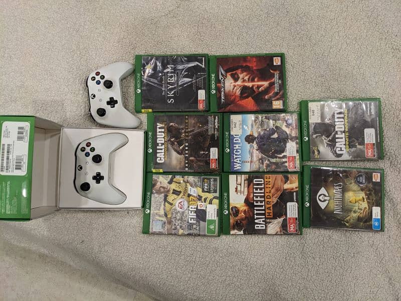 Xbox one s with 8 games and two controller 1