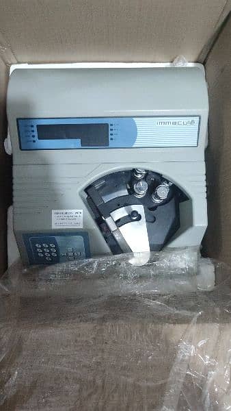 cash counting machine with fake note detection 1 year warranty. 9