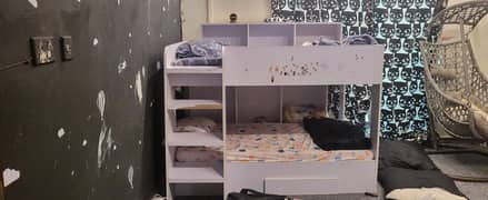Kids bunk bed with book shelves and drawer