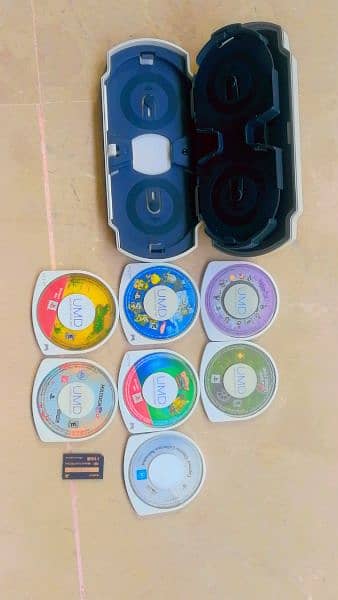 1 PSP UMD Case,7 UMD and 1 orignal Sony memory card install 3 games 2