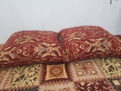 2 floor cushions and 2 round pillows