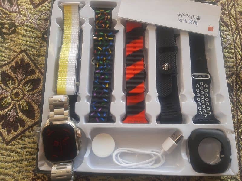 2 Apple watch ultra, ultra2 with cover and earbuds 0