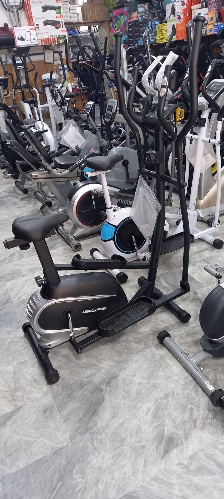 Exercise bike Elliptical Cros Trainer full body workout dumbbell plate 12
