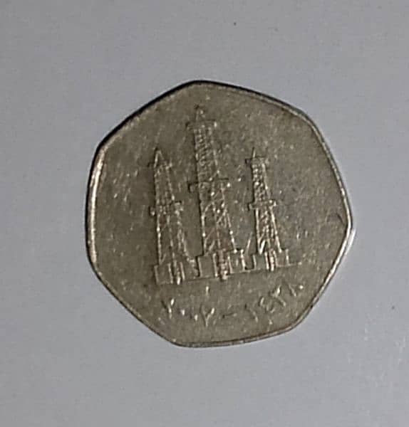 2x 50 fils UAE and 1x 0.5riyal Saudi Arabia coin 1