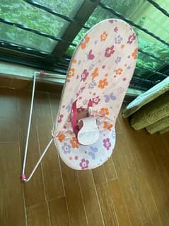 pink baby bouncer with box