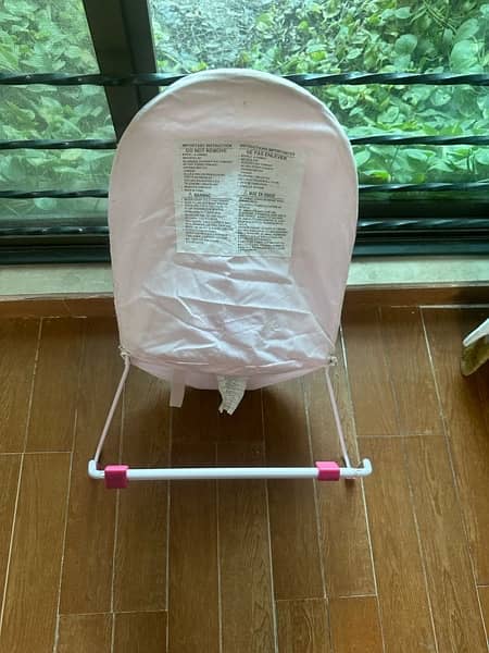 pink baby bouncer with box 1