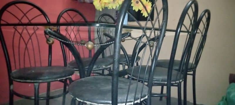 glass table and iron rod 6 chairs 3