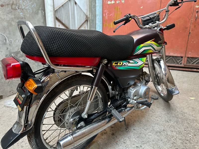 honda 70 with golden number ARU 1111 1