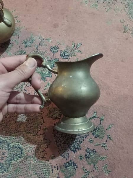 2 Antique tea pots and 1 water pitcher, made of brass 9