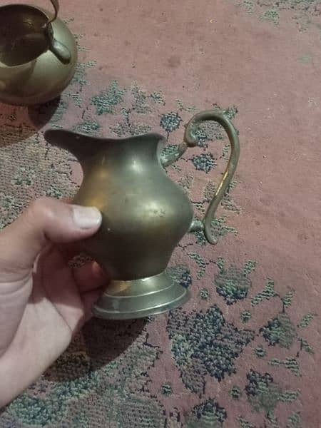 2 Antique tea pots and 1 water pitcher, made of brass 10