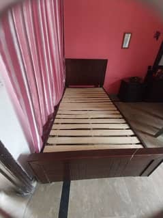 wooden single bed with single side table