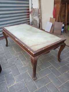 Wooden table with marble slab