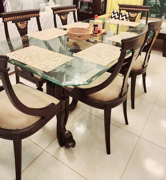 Wodden dining table with six chairs. 1