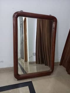 full length wall hanging mirror and dressing table