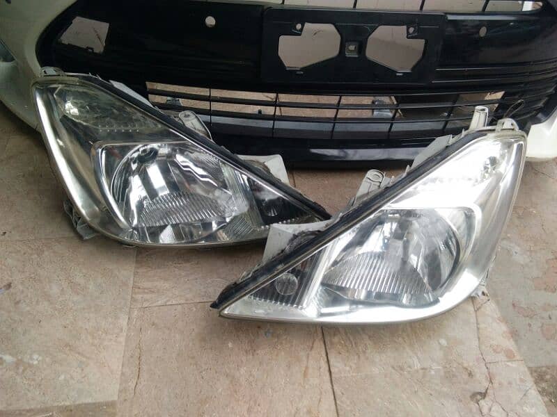 Allion 2003 headlights and rear bumper available 0