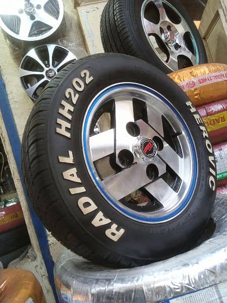 BRAND NEW TYRES WITH SLIGHTLY USED RIMS FOR SUZUKI MEHRAN AND HIROOF 4