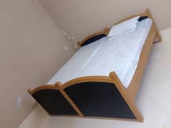 Wooden double bed without mattress
