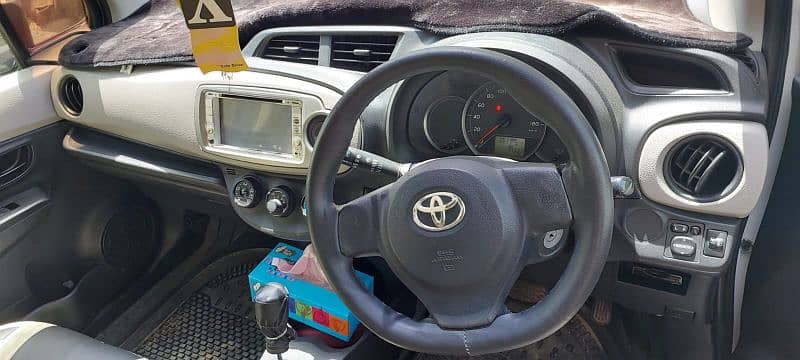 Pearl White Toyota Vitz 7