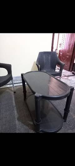 Plastic chairs with table