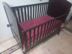 Movable baby cot & convertable little damage else fine condition.