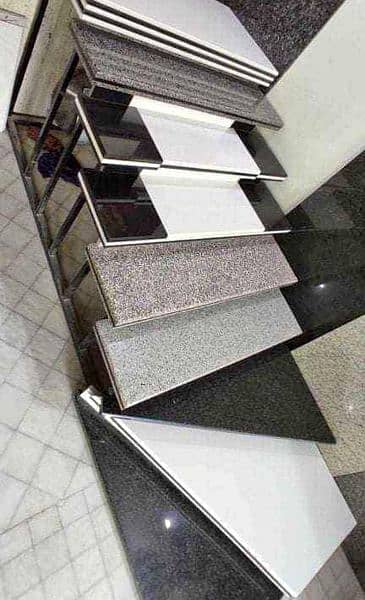 BLACK GRANITE FOR STAIRS AND TRAVERTINE FOR FRONT ELEVATION AVAILABLE 0