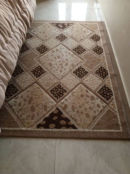 center rug in asking brown color good condition. 0