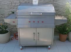 Chargrill with hot plate, side burner, side work top over cabinet
