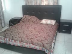 double bed with side table