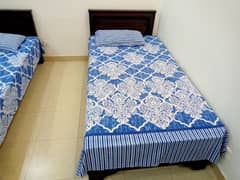 Two single beds with 2 side tables condition (9/10) (without mattress)