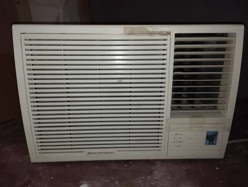 white Westinghouse 2 ton window AC made in Behrain 0