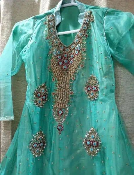 Net short frock with shimar sharara and net dupatta. 1