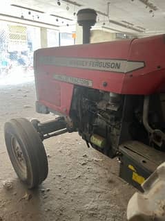 tractor 385 with front blade and seed drill