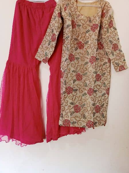 net gharar with golden embroided shirt with pink dupata 1