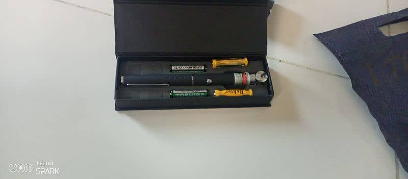 green laser pointer and four batteries are free. 3