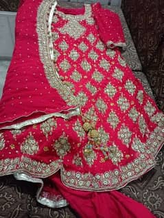 Red colour fraq with heavy bridal dupatta and pajama