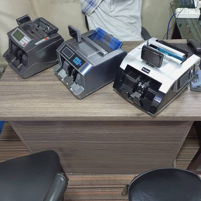 cash counting machine with fake note detection in pakistan. 13