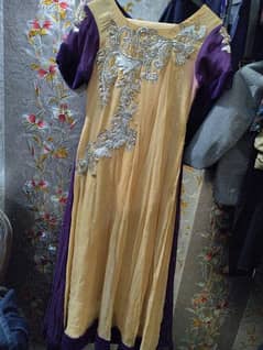 long frock with golden skin and purple contrast