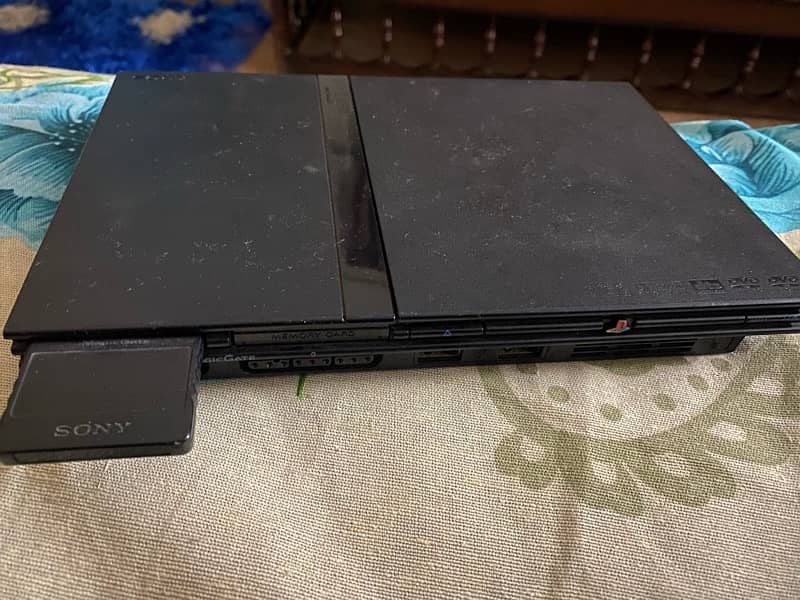 Play Station 2 with 1 console and multiple games (All accessories) 0