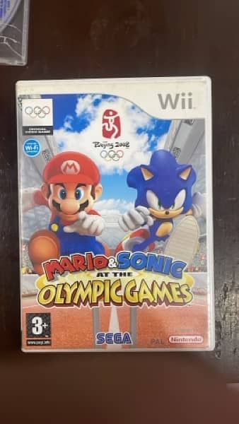 Wii game Brand new condition with remote and 2 games 4
