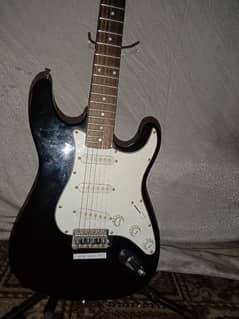 Electric guitar with stand and cable