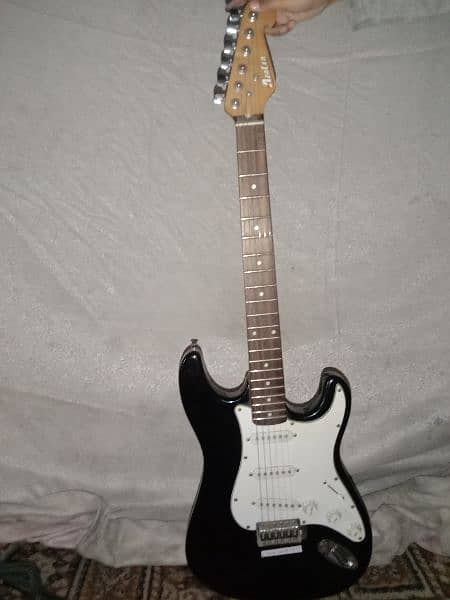 Electric guitar with stand and cable 3