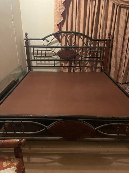 used rodiron king-sized bed with mattress 8