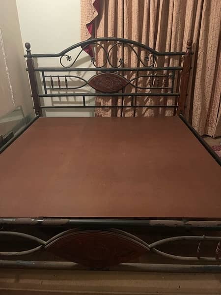 used rodiron king-sized bed with mattress 9