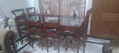 Dinning table, 8 Chairs Glass top, wooden frame