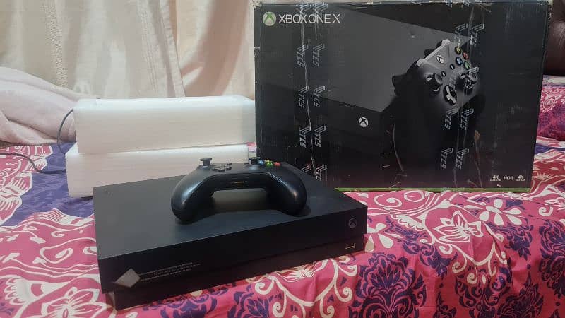 xbox 1X 1tb with box and 1 original controller 2