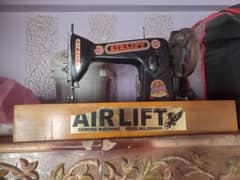 Air lift sewing machine