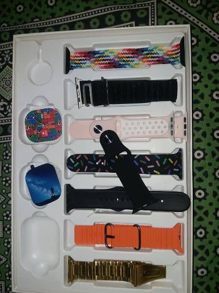 I20 Ultra watch with earpods and six bands 2