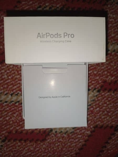 Apple airpods pro. design by Apple in California. assembled in USA. 1
