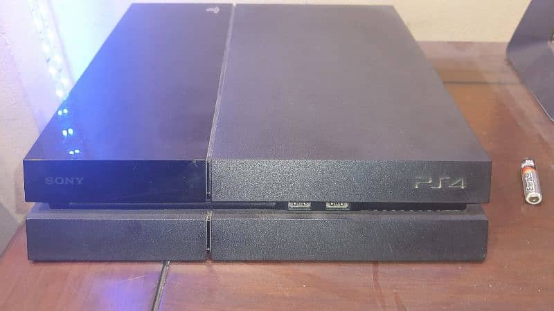 PS4 with box, 1 original & 2 copy controller, charging dock and games 0